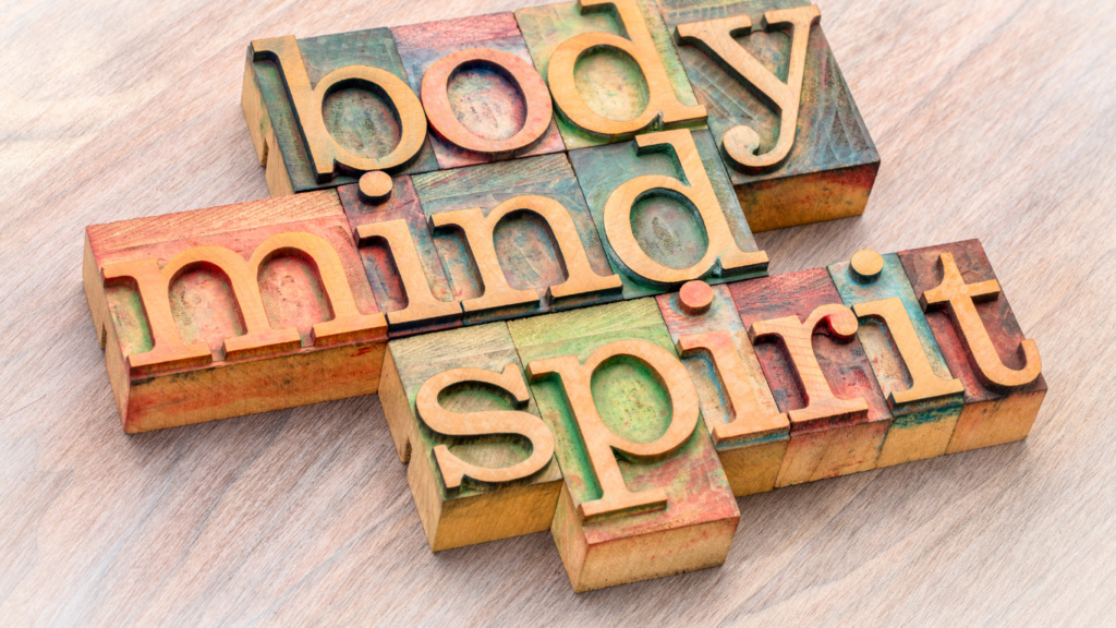 Tension Myositis Syndrome is a disconnection between mind, body and spirit. Colorful blocks spelling out body, mind, spirit. 